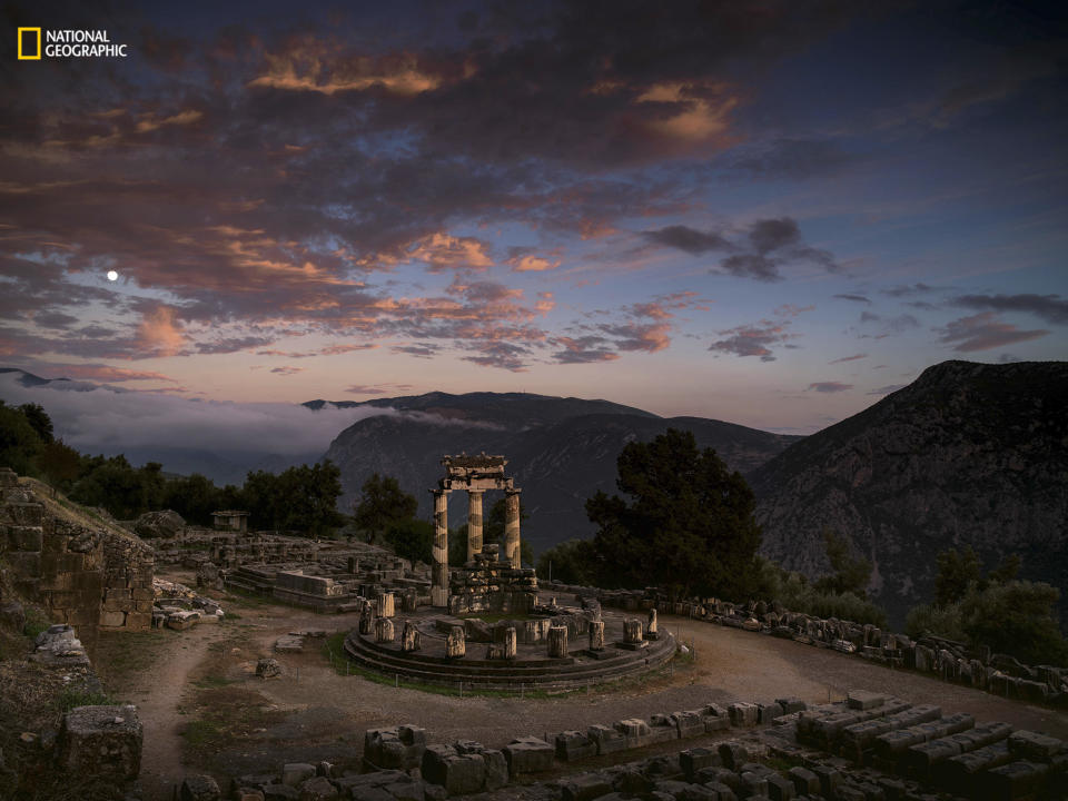 <p>Purple twilight hangs over the sanctuary of Athena Pronaia at Delphi. (Vincent J Musi/National Geographic) </p>