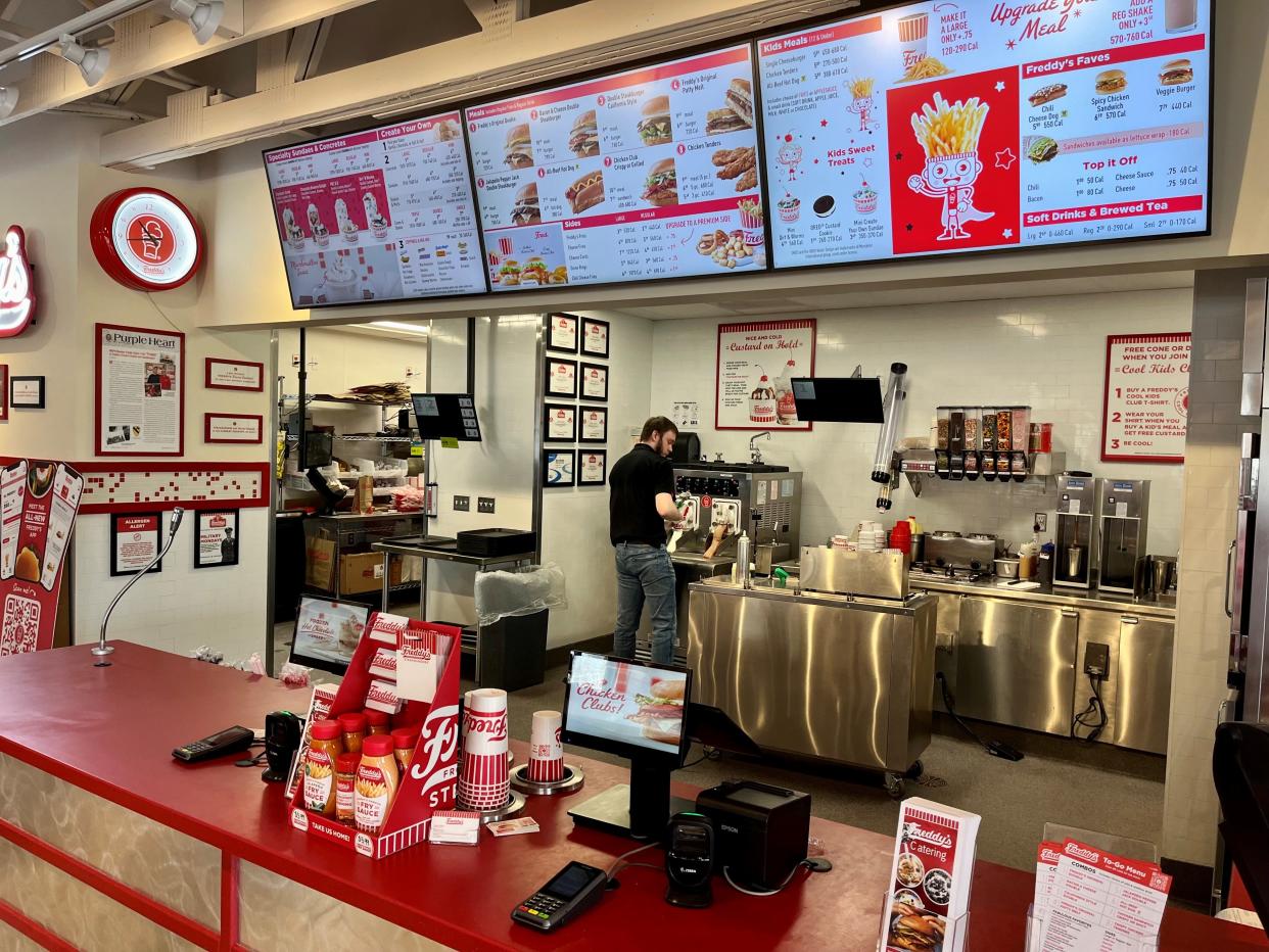 The ordering counter and food preparation area at the Bearden Freddy’s are shown on Jan. 23, 2024. The fast casual restaurant that serves hamburgers, hot dogs, chicken sandwiches and frozen custard opened late last fall.