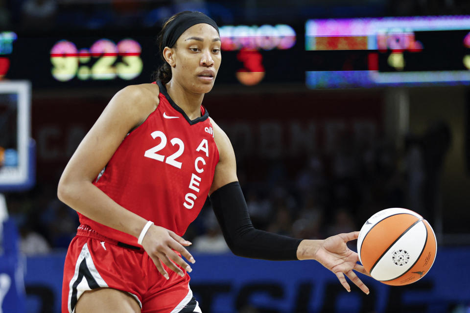 August 25, 2024; Chicago, Illinois, USA; Las Vegas Aces center A'ja Wilson (22) passes the ball against the Chicago Sky during the second half at Wintrust Arena. Mandatory Credit: Kamil Krzaczynski-USA TODAY Sports