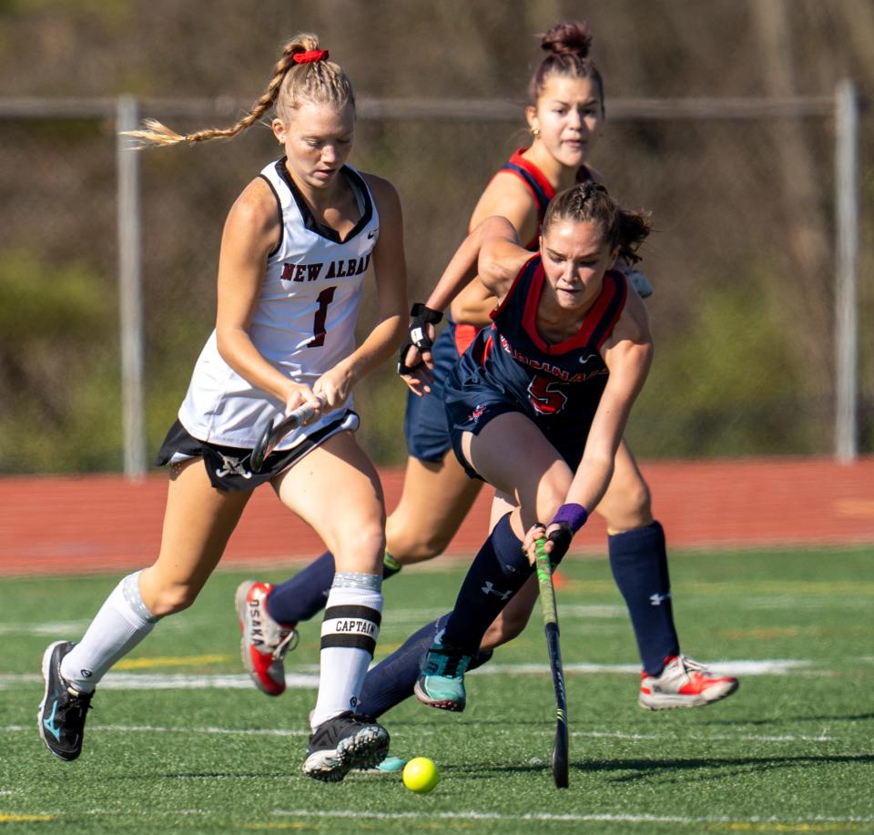 Thomas Worthington's Julie Conroy (5) and New Albany's Paige Cornelius (1) battle for the ball on Saturday.