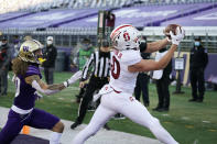 Stanford tight end Scooter Harrington, right, catches a touchdown pass as Washington's Asa Turner trails him in the second half of an NCAA college football game Saturday, Dec. 5, 2020, in Seattle. (AP Photo/Elaine Thompson)