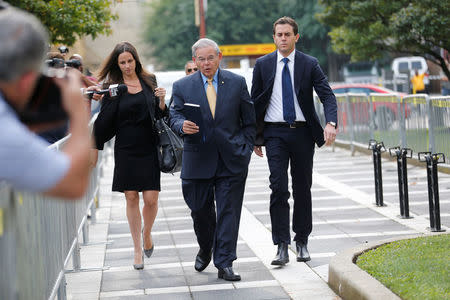 Senator Bob Menendez (C) arrives to face trial for federal corruption charges with his children Alicia Menendez (L) and Robert Melendez, Jr. (R) at United States District Court for the District of New Jersey in Newark, New Jersey, U.S., September 6, 2017. REUTERS/Joe Penney