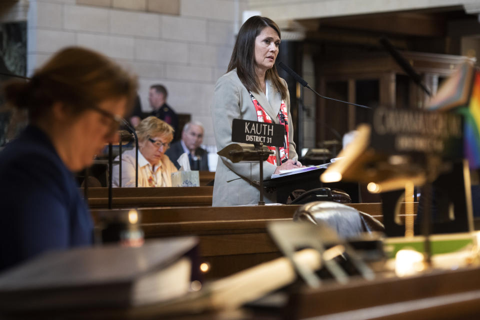 FILE - State Sen. Kathleen Kauth, of Omaha, speaks during the final reading of LB574, which limits gender-affirming care for trans youth, Friday, May 19, 2023, in Lincoln, Neb. A bill to limit transgender students’ access to bathrooms and sports teams has been advanced out of committee with just days to go until the end of the session. Speaker of the Legislature Sen. John Arch announced late Thursday, April 4, 2024, that Kauth’s bill would be debated the next day for no more than four hours. (Justin Wan/Lincoln Journal Star via AP, File)