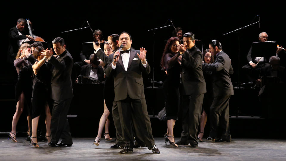 In this July 11, 2013 photo released by The O + M Company, Gilberto Santa Rosa performs with ensemble cast of "Forever Tango" at the Walter Kerr Theatre on in New York. (AP Photo/The O + M Company, Walter McBride)