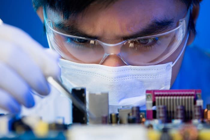 An engineer works on a computer chip.