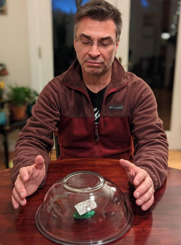 The author practicing psychokinesis with an aluminum foil pinwheel.