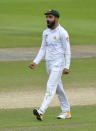 Pakistan's Shadab Khan celebrates the dismissal of England's Ollie Pope during the fourth day of the first cricket Test match between England and Pakistan at Old Trafford in Manchester, England, Saturday, Aug. 8, 2020. (Dan Mullan/Pool via AP)