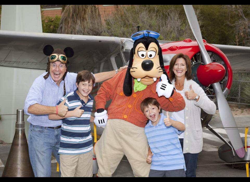 Stephen Colbert, wife Evelyn Colbert and sons Peter Colbert and John Colbert pose with Goofy outside the Soarin Over California attraction at Disney California Adventure park in on August 28, 2010 in Anaheim, California. (Photo by Paul Hiffmeyer/Disney via Getty Images)