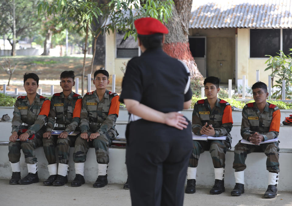 FILE - In this March 31, 2021, file photo, Indian army women recruits attend a class as part of their training before they are inducted as the first women soldiers below officer rank, during a media visit in Bengaluru, India. India’s top court on Wednesday, Sept. 22 allowed young women to take the entrance examination to the country's national defense academy for the first time in November, a watershed moment for them to join the armed forces as officers. The court had rejected the government plea that women were not suitable for commanding posts in the army, saying male troops were not prepared yet to accept female officers. (AP Photo/Aijaz Rahi)