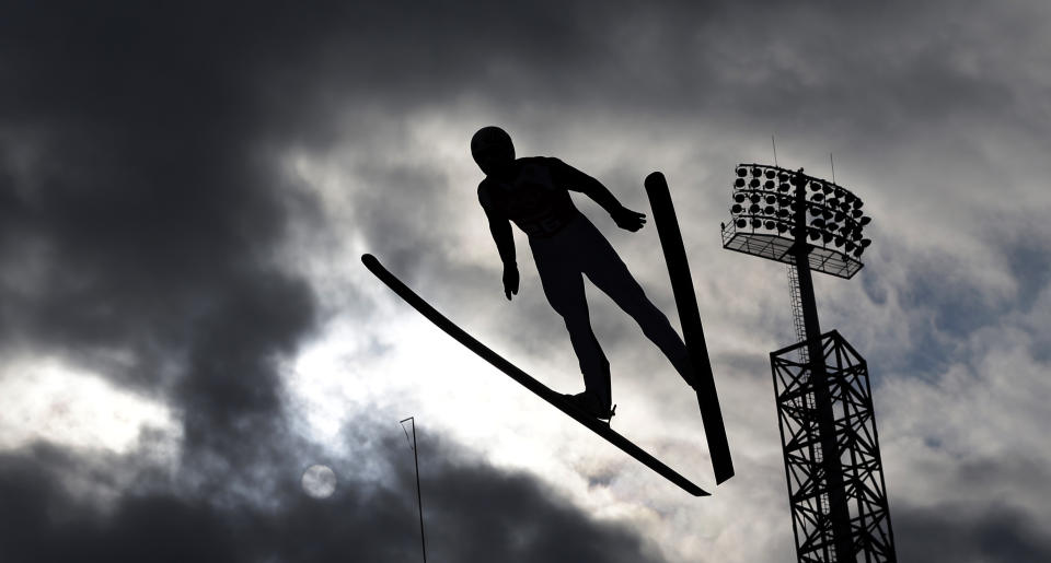 France's Sebastian Lacroix soars through the air during a men's nordic combined training session in the ski jumping stadium at the 2014 Winter Olympics, Monday, Feb. 10, 2014, in Krasnaya Polyana, Russia. (AP Photo/Matthias Schrader)