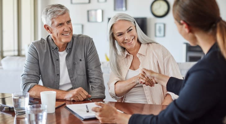 A couple talking to a financial advisor about bonus annuities