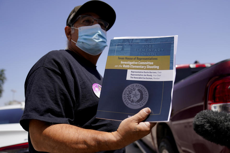 Vincent Salazar, grandfather of Layla Salazar who was killed in the school shooting at Robb Elementary, holds a report released by the Texas House investigative committee on the shootings at Robb Elementary School, Sunday, July 17, 2022, in Uvalde, Texas. Two teachers and 19 students were killed. / Credit: Eric Gay / AP