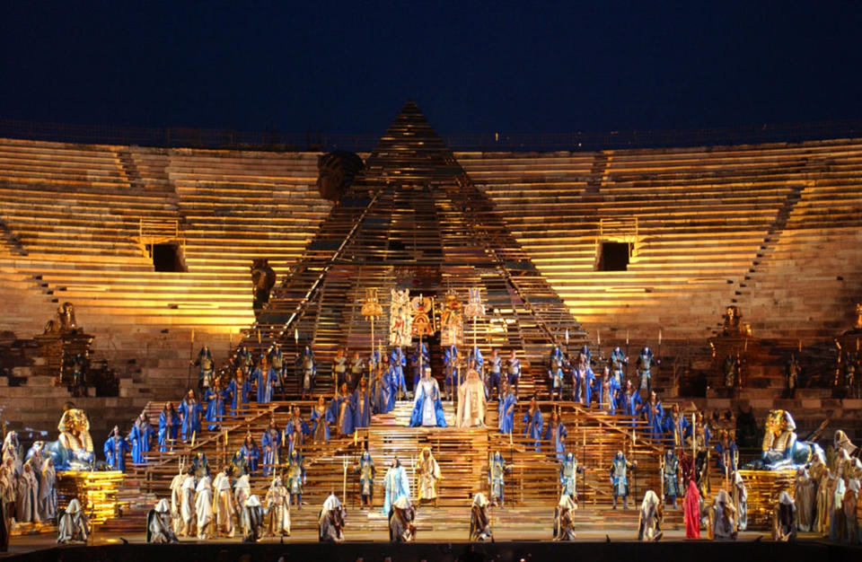FILE - In this June 21, 2002 file photo, a huge pyramid dominates the stage of the opening performance of Giuseppe Verdi's Aida in the Verona Arena, northern Italy. Riccardo Muti will open the season on June 19 and 22, conducting a concert version of “Aida” to mark the 150th anniversary of the Verdi title whose pageantry has made it a festival mainstay. (AP Photo/Claudio Martinelli)