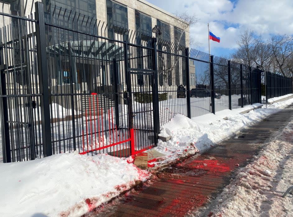 Red paint could be seen splashed on the snow and sidewalk in front of the Russian Embassy in Ottawa when hundreds of residents turned out for a rally in support of Ukraine on Sunday, Feb. 27, 2022