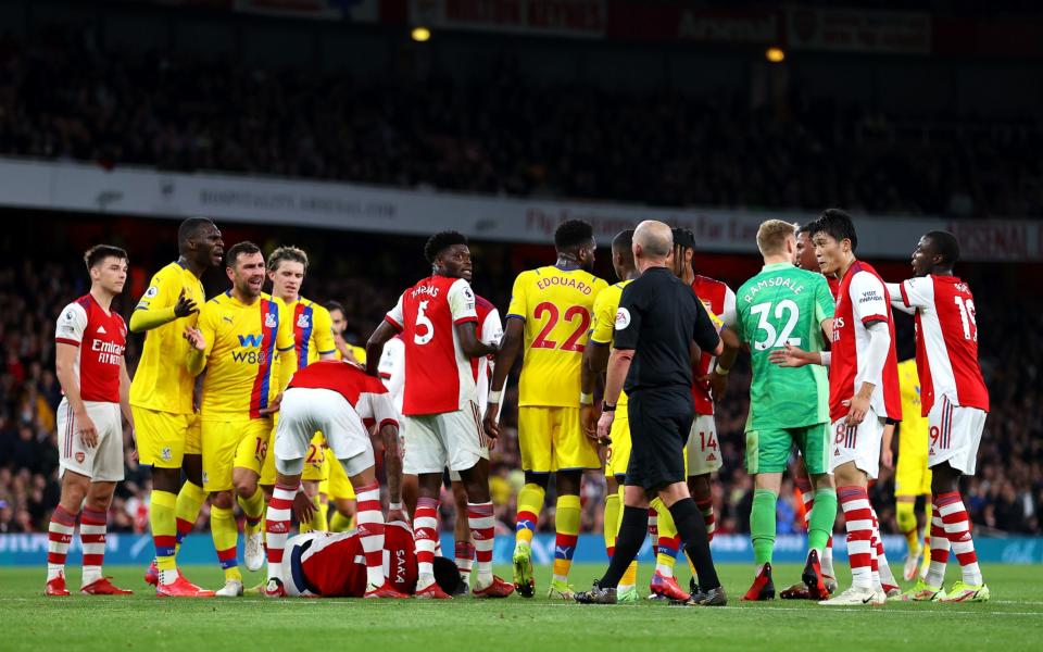 The players clash after a foul on Bukayo Saka of Arsenal - Getty