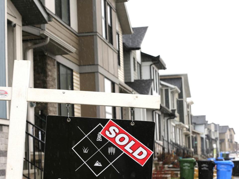  A ‘sold’ sign is shown in front of a row of houses in the southeast Calgary neighbourhood of Belvedere.