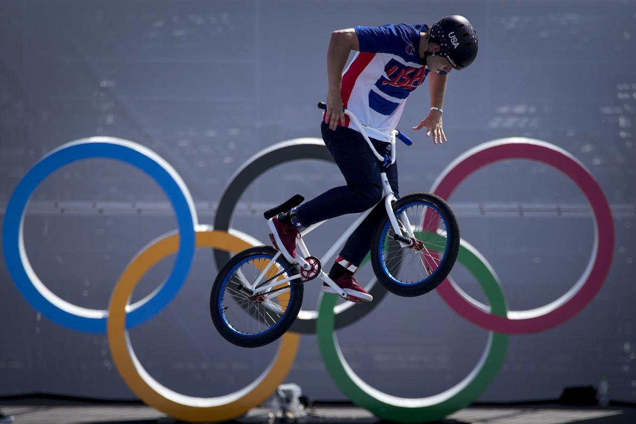 Justin Dowell, of the United States, makes a jump during a BMX Freestyle training session at the 2020 Summer Olympics, Tuesday, July 27, 2021, in Tokyo, Japan.