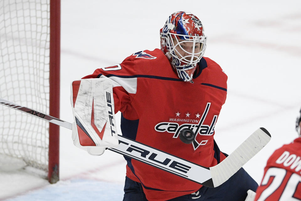Washington Capitals goaltender Ilya Samsonov stops the puck during the second period of the team's NHL hockey game against the Philadelphia Flyers, Tuesday, April 13, 2021, in Washington. (AP Photo/Nick Wass)