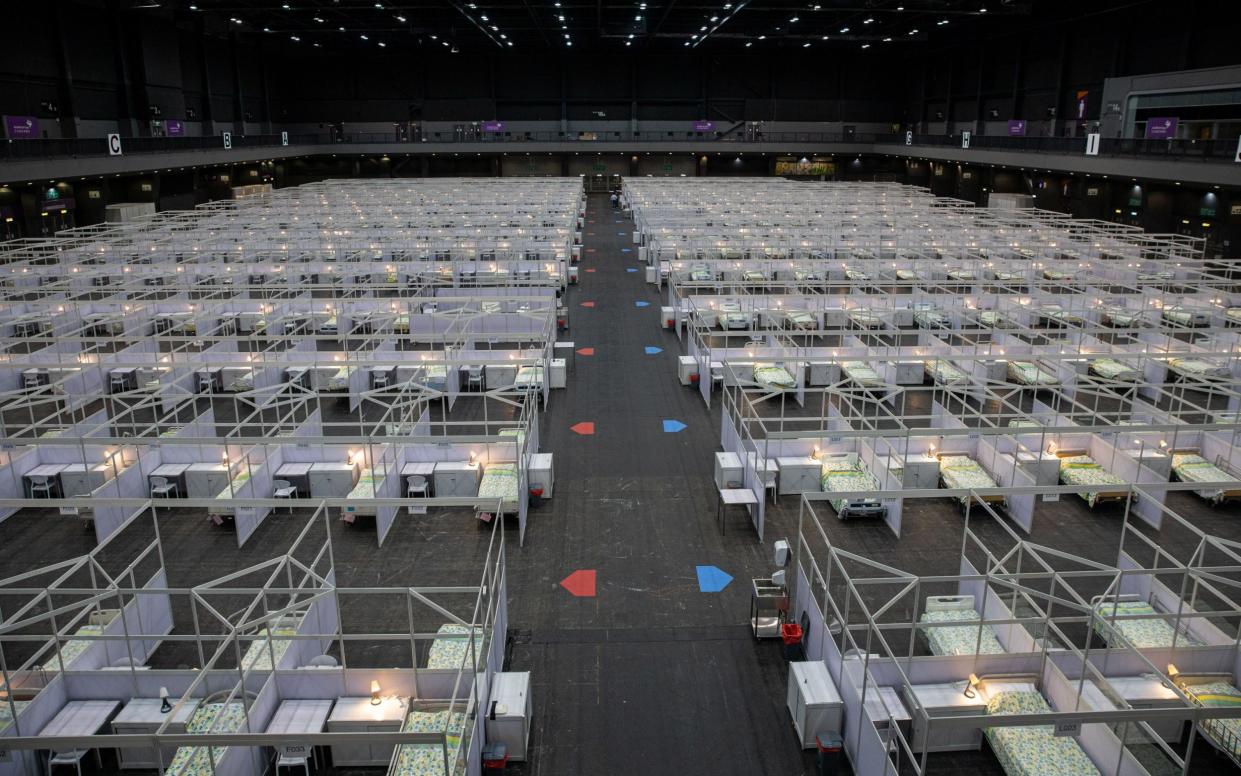 Beds for Covid-19 patients are set up in a temporary facility at the AsiaWorld Expo in Hong Kong - JEROME FAVRE/EPA-EFE/Shutterstock