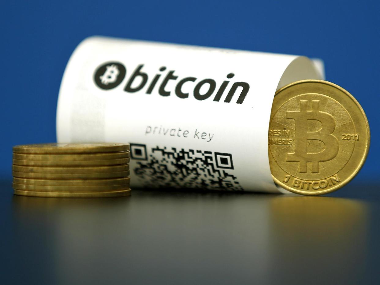 A Bitcoin (virtual currency) paper wallet with QR codes and a coin are seen in an illustration picture taken at La Maison du Bitcoin in Paris, France, May 27, 2015: REUTERS/Benoit Tessier