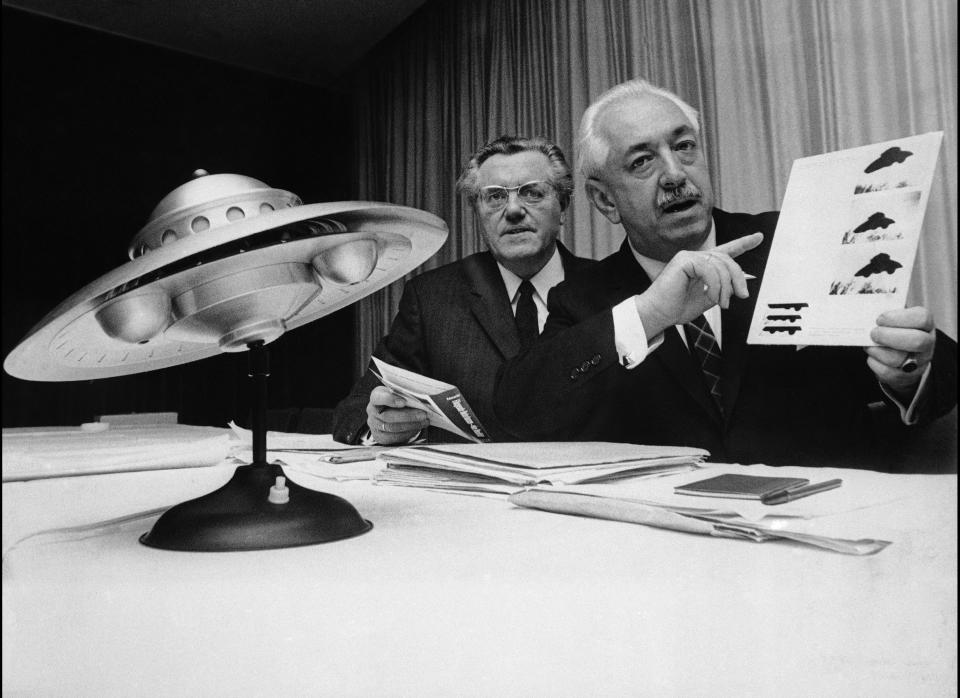 World reception center for official visitors from outer space was proposed by an American specialist on unidentified flying objects (UFOs). Hungarian-born Colman von Keviczky, a former United Nations official, right, for the effective solution of the global problem. (Photo credit: PA)