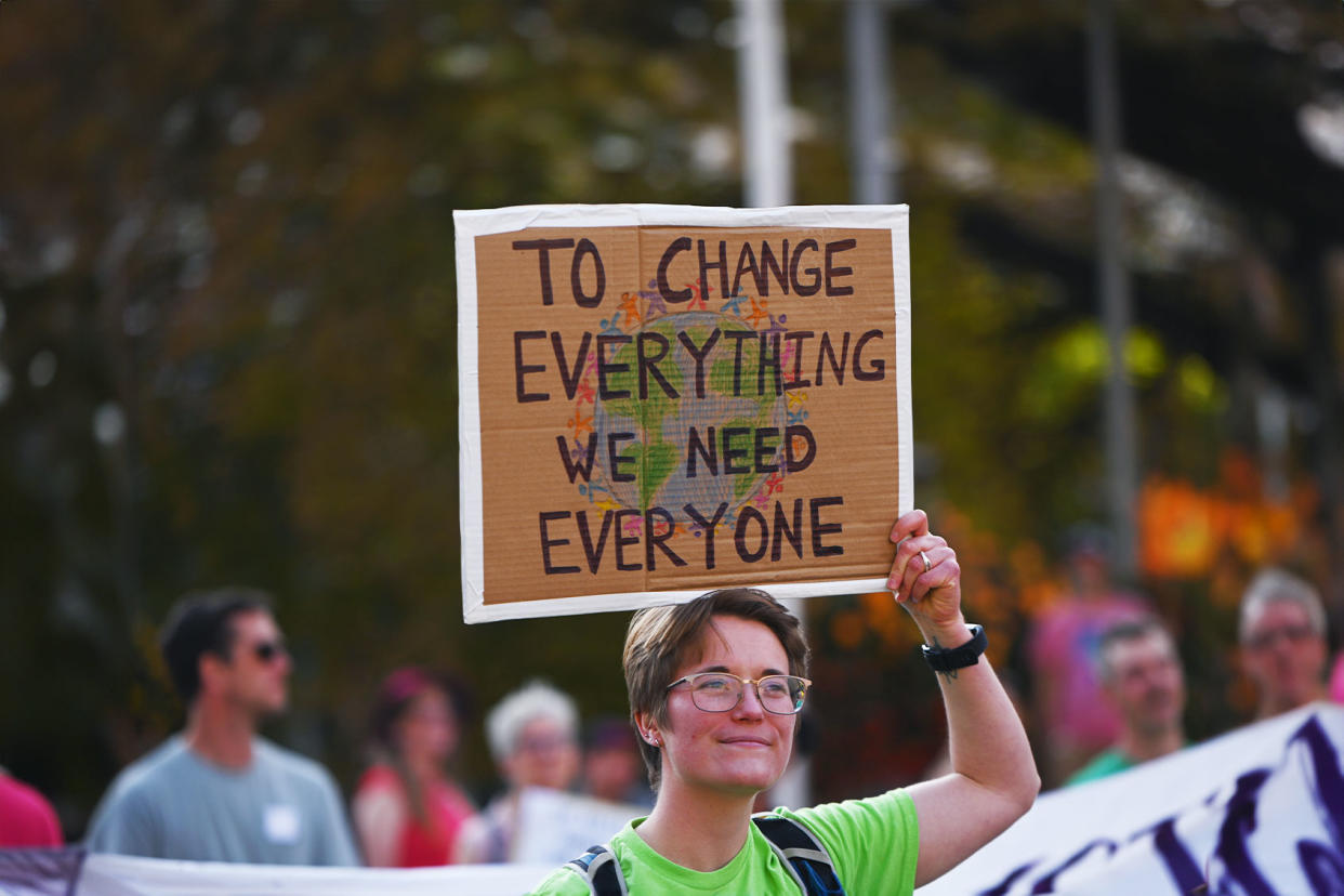 Climate protest sign Stringer/Anadolu Agency via Getty Images