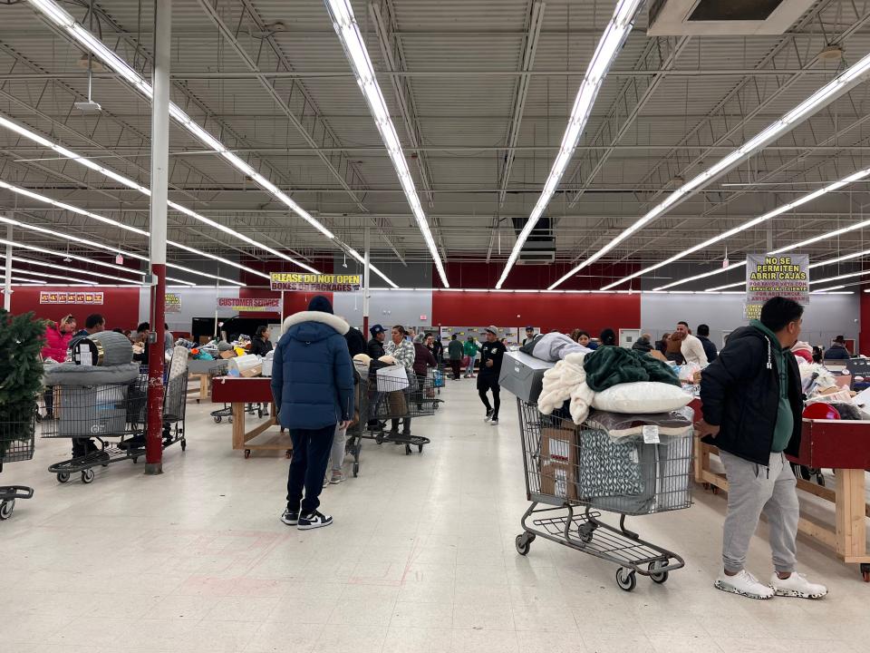 shoppers with tons of stuff in their carts at crazy hot deals