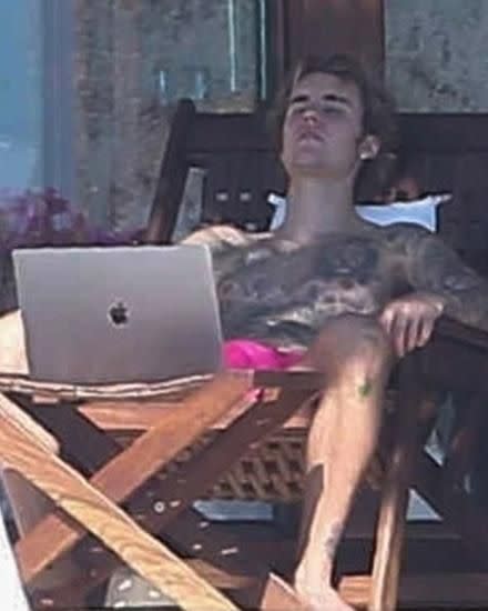 Bieber snapped taking a snooze while getting some rays lying shirtless on his villa balcony. Source: Backgrid