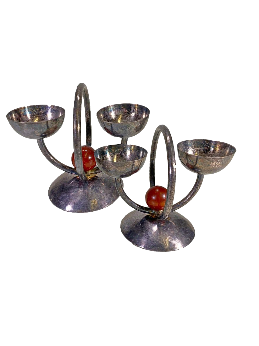 <p><a href="https://www.liveauctioneers.com/item/172143919_bepwf-berliner-elektro-plated-pair-of-egg-holders" rel="nofollow noopener" target="_blank" data-ylk="slk:Shop Now;elm:context_link;itc:0;sec:content-canvas" class="link rapid-noclick-resp">Shop Now</a></p><p>BEPWF Berliner Elektro Plated Pair of Egg Holders</p><p>liveauctioneers.com</p><p>$1.00</p>