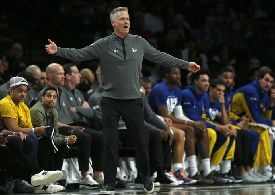 Golden State Warriors head coach Steve Kerr works the sideline during the first half of an NBA basketball game against the Brooklyn Nets, Monday, Feb. 5, 2024, in New York. (AP Photo/John Munson)