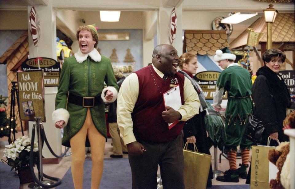 Buddy the Elf (Will Ferrell, left, with Faizon Love) is excited for Santa in a scene from "Elf."