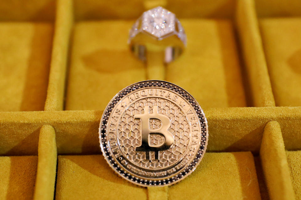 Jewelry with the Bitcoin logo is seen on display at the Consensus 2018 blockchain technology conference in New York City, New York, U.S., May 16, 2018. REUTERS/Mike Segar