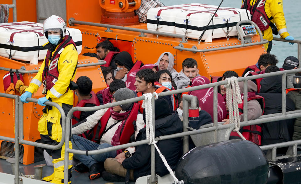 A group of people thought to be migrants are brought in to Dover, Kent, onboard an RNLI vessel, following a small boat incident in the Channel. Picture date: Monday October 18, 2021. (Photo by Gareth Fuller/PA Images via Getty Images)