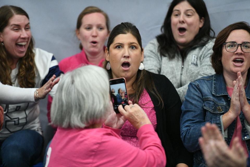 Plymouth North High School English teacher Michelle "Shelley" Terry learns she is a winner of the Milken Education Award from the Milken Family Foundation during a surprise schoolwide assembly Friday, Oct. 20. The award comes with an unrestricted $25,000 prize.