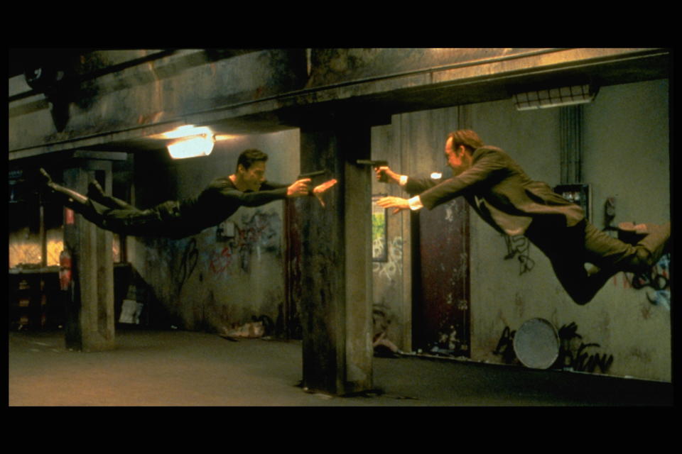 Keanu Reeves and Hugo Weaving face each other in a scene from Andy and Larry Wachowski's 1999 movie The Matrix. In this scene, Neo (Reeves) fights the computerized Agent Smith (Weaving). (Photo by Siemoneit/Sygma via Getty Images)