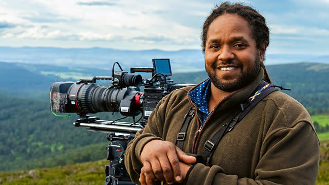  Hamza: Strictly Birds of Prey - Hamza Yassin posing with a camera outdoors. 