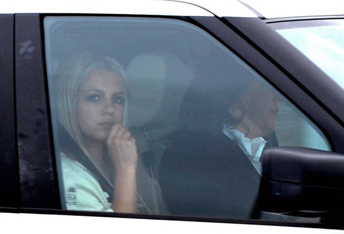 Britney looking out the window as she sits in the front passenger's seat