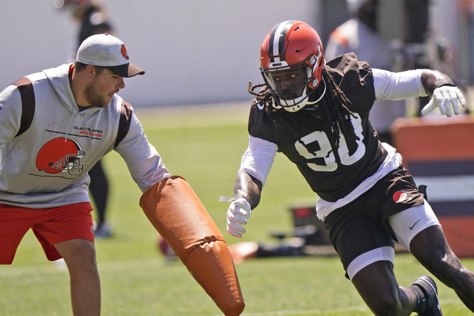 Cleveland Browns linebacker Jadeveon Clowney (90) runs a drill during an NFL football practice, Monday, Aug. 2, 2021, in Berea, Ohio. (AP Photo/Tony Dejak)