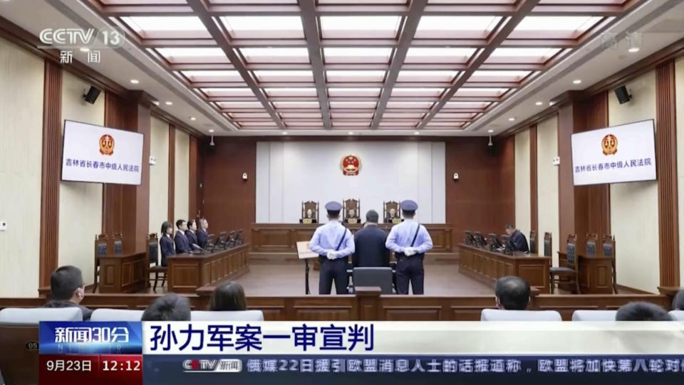 In this image taken from video footage run by China's CCTV, Sun Lijun, former vice minister of public security, attends a court sentencing in Changchun in northeastern China's Jilin province on Friday, Sept. 23, 2022. The former deputy Chinese police minister who was accused of leading a crime gang of government officials was given a death sentence with a two-year reprieve Friday on charges of manipulating the stock market, taking bribes and other offenses, state TV reported Friday, Sept. 23, 2022 (CCTV via AP)