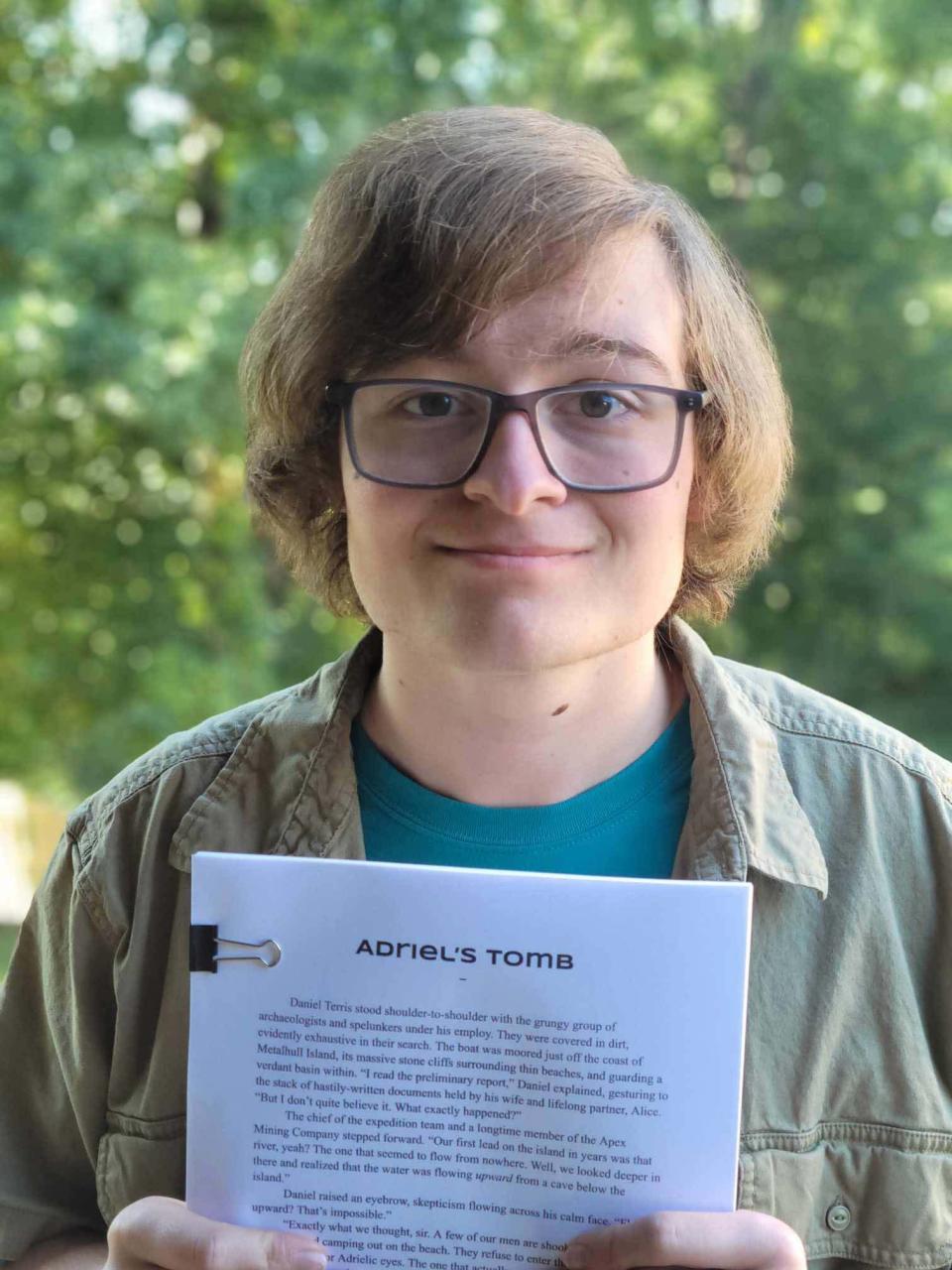 Hardin Valley Academy sophomore Brandon Dowty shows off his manuscript “Adriel’s Tomb,” which won him a cash prize, a medal, and an excerpt published in the 2023 YoungArts Anthology.