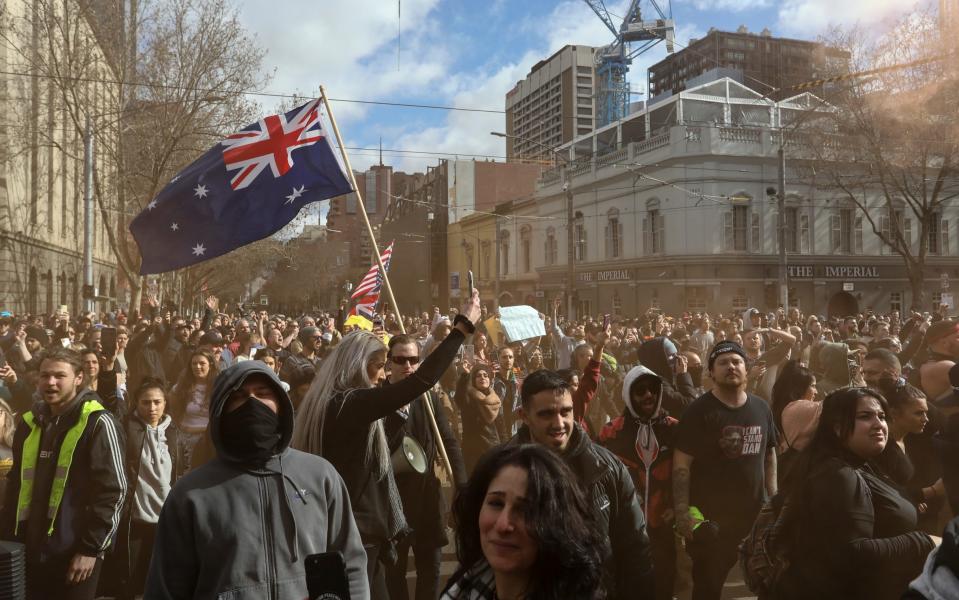 Protesters gather in front of Parliament House during a World Wide rally for freedom on July 24, 2021 in Melbourne, Australia. Anti-lockdown and anti-vaccination activists gathered in cities across Australia with New South Wales and Victoria are under strict Covid-19 restrictions as the states continue to fight the spread of the delta coronavirus strain. - Getty Images