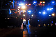 FILE - Police officers work an active shooter scene on Poplar Avenue in Memphis, Tenn. on Wednesday, Sept. 7, 2022. Ezekiel Kelly is now accused of killing three people, wounding three others and bringing Memphis to a terrified standstill that early September night. (Mark Weber/Daily Memphian via AP, File)