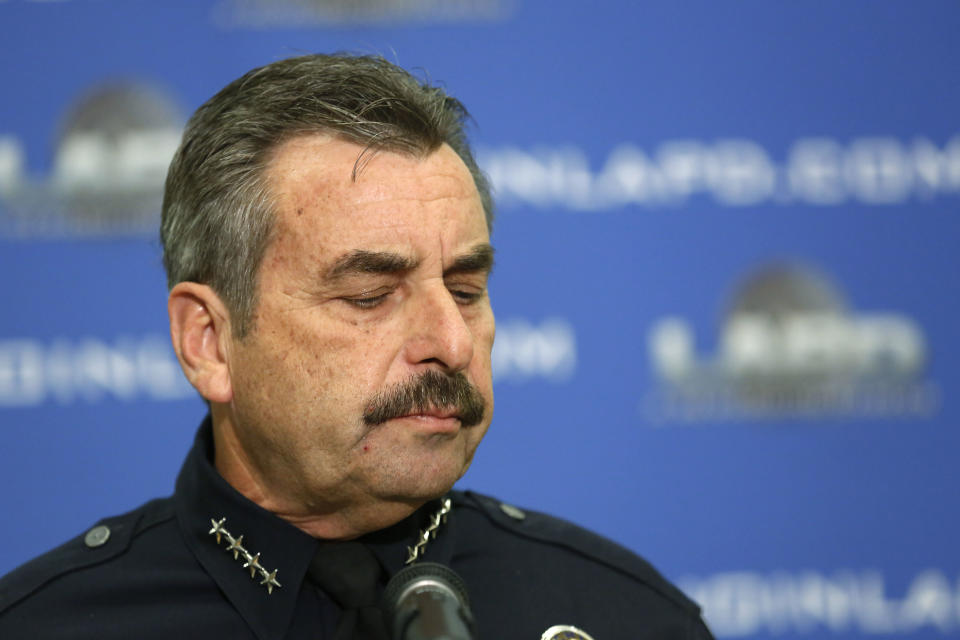 Los Angeles Police Chief Charlie Beck speaks at a news conference at LAPD headquarters in downtown Los Angeles Tuesday, Feb. 4, 2014. A civilian oversight board has determined that eight Los Angeles police officers violated department policy when they mistakenly opened fire on two women during the manhunt for rogue ex-cop Christopher Dorner. The Police Commission's decision announced Tuesday leaves the question of disciplinary measures to Beck. The officers have been assigned to non-field duties pending the internal investigation. (AP Photo/Reed Saxon)