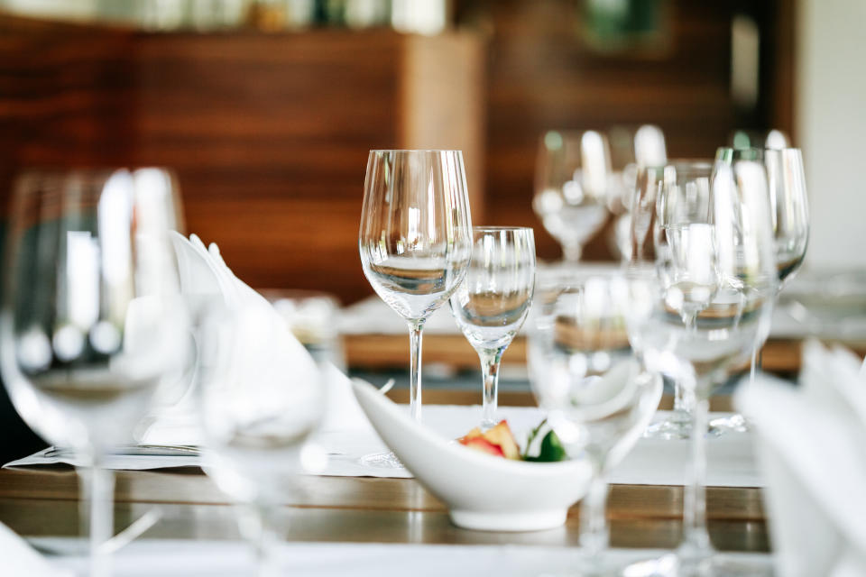 empty wine glasses with the table settings in a restaurant