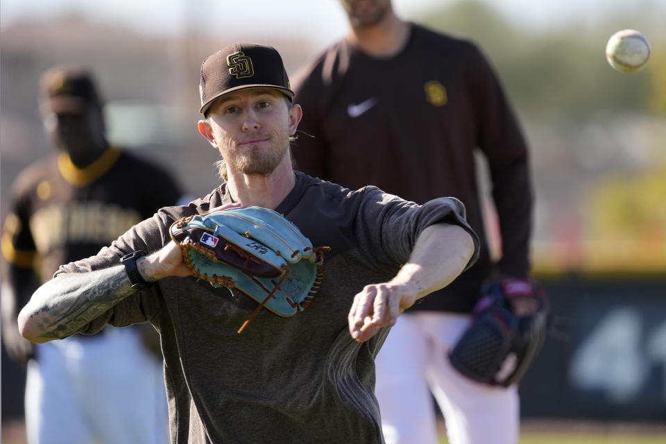 San Diego Padres relief pitcher Josh Hader participates in a drill during spring training baseball practice Saturday, Feb. 18, 2023, in Peoria, Ariz. (AP Photo/Charlie Riedel)