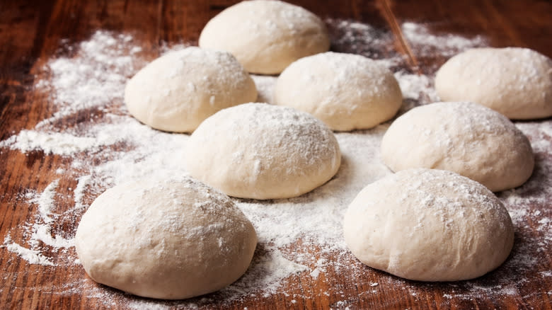 balls of floured pizza dough