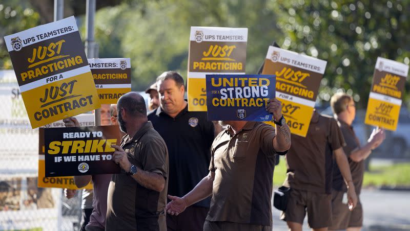 UPS workers go through a rehearsal of a pending strike at the UPS Customer Center Thursday, July 13, 2023, in Longwood, Fla.