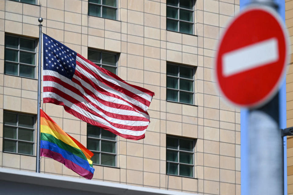 An American flag and a Pride flag are pictured on the U.S. embassy in Moscow, Russia, on June 30, 2022.  / Credit: NATALIA KOLESNIKOVA/AFP via Getty Images