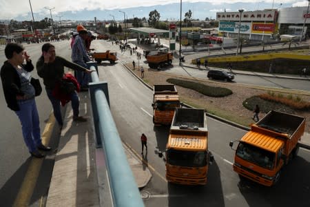 Trucks block main roads during protests after Ecuador's President Lenin Moreno's government ended four-decade-old fuel subsidies, in Carapungo, near Quito