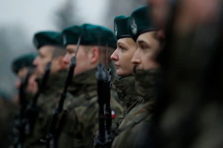 Town hall clerk Monika Pawlik is seen during a swearing-in ceremony for Poland's territorial army in Bialystok, Poland December 16, 2017. Picture taken December 16, 2017. REUTERS/Kacper Pempel/Files